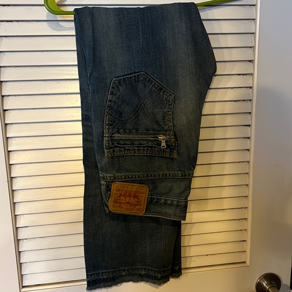Levi’s 527 blue jeans  boot cut with back zipper pockets in good condition